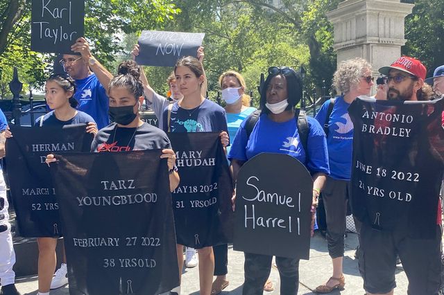 At a rally on Thursday in front of City Hall, activists opposed to the use of solitary confinement at Rikers Island held up signs with the names of people who died in Department of Correction custody.